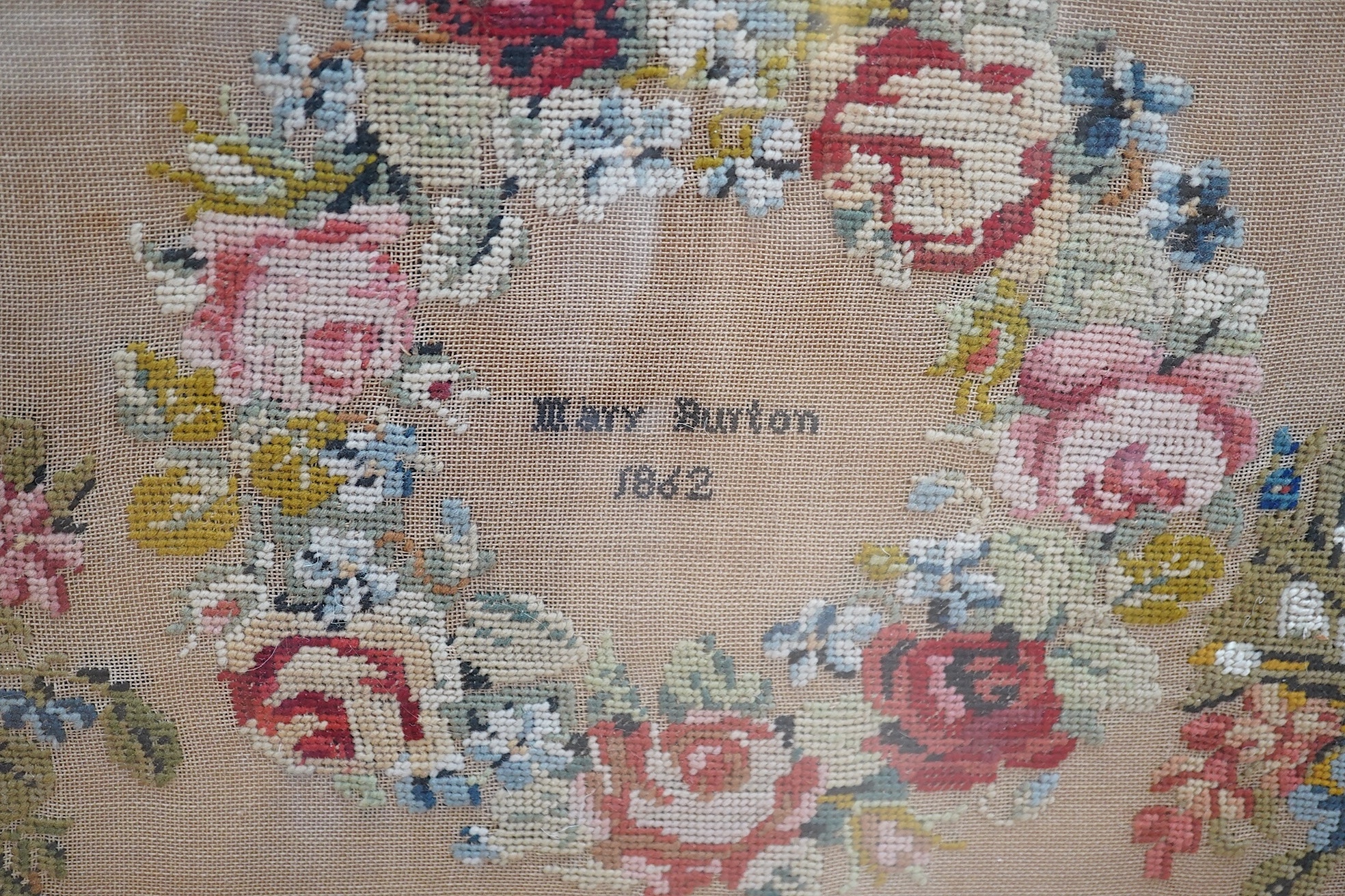 Two Victorian framed samplers; a large colourful floral sampler with short verse by Mary Burton 1862 and a smaller sampler by Julia Warner aged 13, dated 1846?, large 1862 sampler 59cm wide x 61cm high. Condition - large